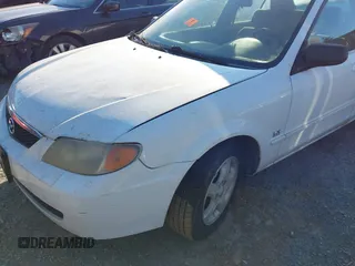 2001 Mazda Protege LX with VIN JM1BJ225710406286, listed as a IAAI auction lot 41887127 with Not Provided miles and . Bid and sale history available at DreamBid. Image 12.