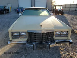 1985 Cadillac Eldorado z VIN 1G6EL5781FE647818, wystawiony jako Copart lot #77608224 z przebiegiem 7192 mil mil oraz Tytuł czysty. Historia ofert i sprzedaży dostępna na DreamBid. Obrazek 5.