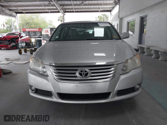 2009 Toyota Avalon XL with VIN 4T1BK36B69U341854, listed as a IAAI auction lot 41727553 with 102,369 mi miles. Bid and sale history available at carsss.com. Image 12.