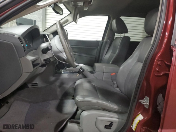 2007 Jeep Grand Cherokee Laredo with VIN 1J8GR48K27C687033, listed as a Copart auction lot 52401165 with 135,146 mi miles and Salvage Title. Bid and sale history available at carsss.com. Image 7.