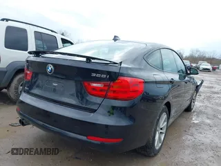 2014 BMW 3 Series 328i Gran Turismo xDrive z VIN WBA3X5C51ED558871, wystawiony jako IAAI lot #41940706 z przebiegiem 74 126 mil mil oraz . Historia ofert i sprzedaży dostępna na DreamBid. Obrazek 4.