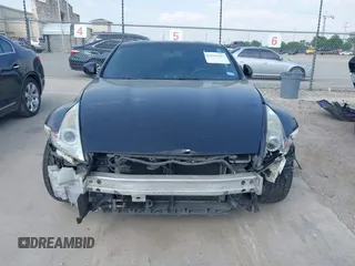 2015 Nissan 370Z z VIN JN1AZ4EH2FM442556, wystawiony jako IAAI lot #41956287 z przebiegiem 128 769 mil mil oraz . Historia ofert i sprzedaży dostępna na DreamBid. Obrazek 13.