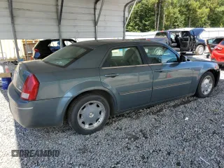 2005 Chrysler 300 Touring z VIN 2C3JA53G65H574021, wystawiony jako Copart lot #70073414 z przebiegiem 291 219 mil mil oraz Szkoda całkowita • Salvage title. Historia ofert i sprzedaży dostępna na DreamBid. Obrazek 3.