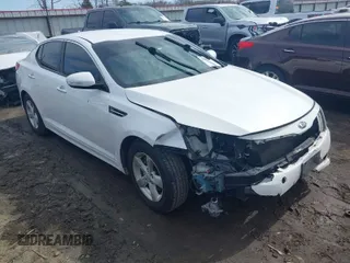 2015 Kia Optima LX z VIN KNAGM4A7XF5630994, wystawiony jako IAAI lot #41677800 z przebiegiem 124 742 mil mil oraz . Historia ofert i sprzedaży dostępna na DreamBid. Obrazek 1.