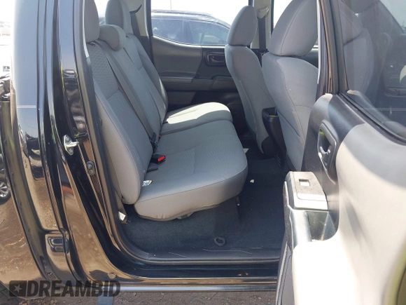 2018 Toyota Tacoma SR with VIN 5TFAX5GN5JX126118, listed as a IAAI auction lot 41949791 with 37,615 mi miles and . Bid and sale history available at DreamBid. Image 8.