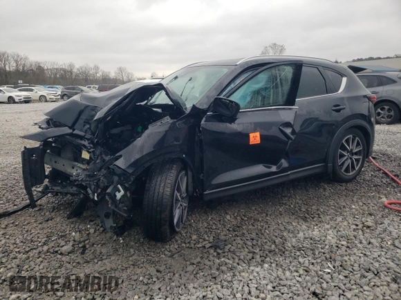 2018 Mazda CX-5 Grand Touring z VIN JM3KFBDM0J0403095, wystawiony jako Copart lot #48594495 z przebiegiem Nie podano mil oraz Szkoda całkowita • Salvage title. Historia ofert i sprzedaży dostępna na DreamBid. Obrazek 1.