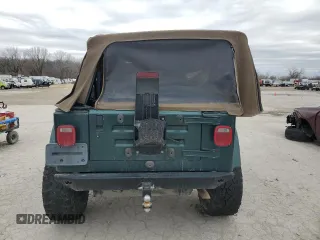 2000 Jeep Wrangler Sahara z VIN 1J4FA59S5YP803327, wystawiony jako Copart lot #44382505 z przebiegiem Nie podano mil oraz Szkoda całkowita • Salvage title. Historia ofert i sprzedaży dostępna na DreamBid. Obrazek 6.