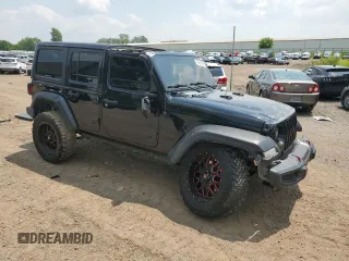 2020 Jeep Wrangler Unlimited Sport Altitude with VIN 1C4HJXDG2LW102854, listed as a Copart auction lot 60245695 with 134,575 mi miles and Non repairable. Bid and sale history available at DreamBid. Image 4.