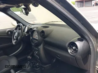 2014 MINI Countryman S with VIN WMWZC3C59EWP25041, listed as a IAAI auction lot 42085698 with 109,320 mi miles and . Bid and sale history available at DreamBid. Image 5.