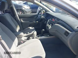 2004 Mitsubishi Lancer ES with VIN JA3AJ26E54U052124, listed as a IAAI auction lot 41804473 with 165,786 mi miles. Bid and sale history available at carsss.com. Image 5.