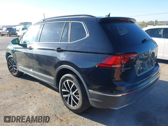 2021 Volkswagen Tiguan SE z VIN 3VV3B7AX0MM080853, wystawiony jako IAAI lot #42406539 z przebiegiem 73 295 mil mil oraz . Historia ofert i sprzedaży dostępna na DreamBid. Obrazek 3.
