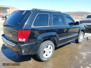 2007 Jeep Grand Cherokee Laredo with VIN 1J8GR48K67C523705, listed as a IAAI auction lot 41774281 with 215,572 mi miles. Bid and sale history available at carsss.com. Image 4.