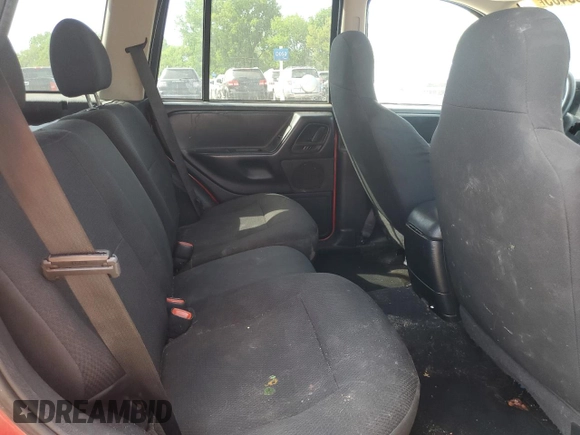 2004 Jeep Grand Cherokee Laredo z VIN 1J4GW48S24C220989, wystawiony jako Copart lot #56759465 z przebiegiem 227 612 mil mil oraz Szkoda całkowita • Salvage title. Historia ofert i sprzedaży dostępna na DreamBid. Obrazek 11.