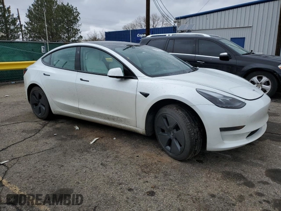 2023 Tesla Model 3 with VIN 5YJ3E1EAXPF600008, listed as a Copart auction lot 51868055 with 58,733 mi miles and Salvage title. Bid and sale history available at DreamBid. Image 4.
