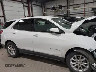 2018 Chevrolet Equinox LT z VIN 3GNAXJEV9JL410690, wystawiony jako IAAI lot #41571620 z przebiegiem 21 797 mil mil oraz . Historia ofert i sprzedaży dostępna na DreamBid. Obrazek 12.