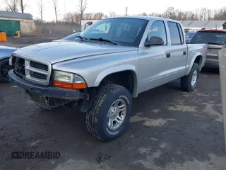 2002 Dodge Dakota Sport with VIN 1B7HG38N12S661043, listed as a IAAI auction lot 41552725 with 206,662 mi miles. Bid and sale history available at carsss.com. Image 2.