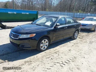 2009 Kia Optima LX with VIN KNAGE228895356661, listed as a IAAI auction lot 41821857 with 124,692 mi miles. Bid and sale history available at carsss.com. Image 2.