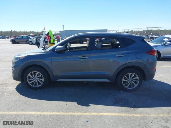 2018 Hyundai Tucson SEL with VIN KM8J3CA48JU718402, listed as a IAAI auction lot 41810363 with 218,853 mi miles. Bid and sale history available at carsss.com. Image 14.