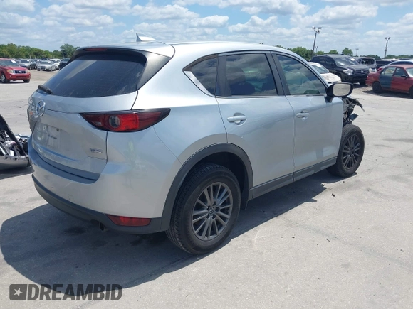 2017 Mazda CX-5 Sport with VIN JM3KFABLXH0135560, listed as a IAAI auction lot 42062016 with 153,416 mi miles. Bid and sale history available at carsss.com. Image 4.