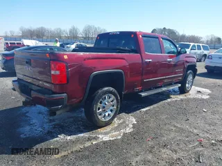 2016 GMC Sierra 2500HD Denali z VIN 1GT12UE87GF287056, wystawiony jako IAAI lot #41753772 z przebiegiem 284 546 mil mil oraz . Historia ofert i sprzedaży dostępna na DreamBid. Obrazek 4.