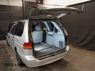 2002 Honda Odyssey LX z VIN 2HKRL18532H573727, wystawiony jako IAAI lot #42266783 z przebiegiem 127 491 mil mil oraz . Historia ofert i sprzedaży dostępna na DreamBid. Obrazek 3.