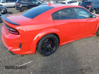 2022 Dodge Charger Scat Pack Widebody with VIN 2C3CDXGJ3NH101081, listed as a IAAI auction lot 41351466 with 9,575 mi miles and . Bid and sale history available at DreamBid. Image 4.