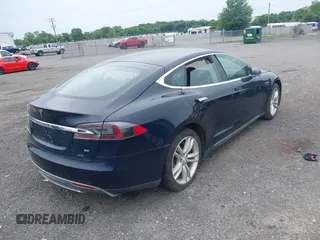 2014 Tesla Model S 60 with VIN 5YJSA1H19EFP32063, listed as a IAAI auction lot 42360872 with 103,495 mi miles and . Bid and sale history available at DreamBid. Image 4.