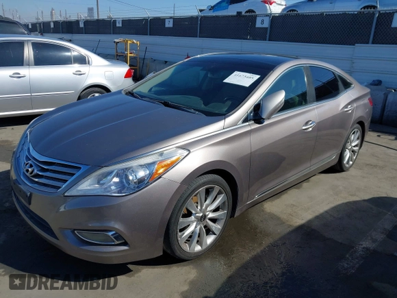 2013 Hyundai Azera with VIN KMHFH4JG2DA256481, listed as a IAAI auction lot 41673405 with 180,130 mi miles and . Bid and sale history available at DreamBid. Image 2.