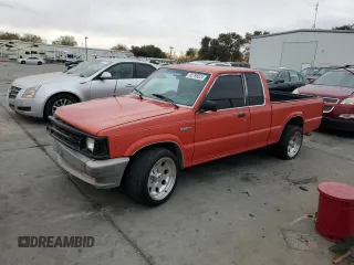 1989 Mazda B-Series Truck with VIN JM2UF313XK0779271, listed as a Copart auction lot 80798524 with 283,234 mi miles and Salvage Title. Bid and sale history available at DreamBid. Image 1.