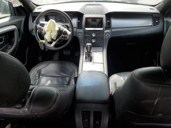 2015 Ford Taurus SEL z VIN 1FAHP2E89FG177287, wystawiony jako Copart lot #56074615 z przebiegiem 196 421 mil mil oraz Szkoda całkowita • Salvage title. Historia ofert i sprzedaży dostępna na DreamBid. Obrazek 8.