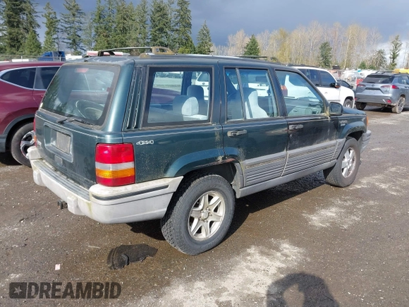 1995 Jeep Grand Cherokee Laredo with VIN 1J4GZ58SXSC676393, listed as a IAAI auction lot 41943464 with 244,317 mi miles. Bid and sale history available at carsss.com. Image 4.