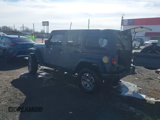 2015 Jeep Wrangler Unlimited Willys Wheeler with VIN 1C4BJWDG4FL589822, listed as a IAAI auction lot 41732614 with 149,112 mi miles and . Bid and sale history available at DreamBid. Image 3.