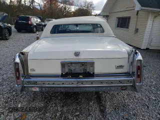 1991 Cadillac Brougham z VIN 1G6DW54E6MR710852, wystawiony jako Copart lot #76027004 z przebiegiem Nie podano mil oraz Szkody całkowita. Historia ofert i sprzedaży dostępna na DreamBid. Obrazek 6.