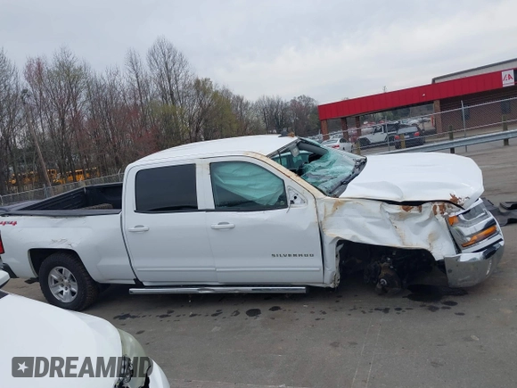 2018 Chevrolet Silverado 1500 LT with VIN 1GCUKREC0JF208509, listed as a IAAI auction lot 41794616 with 96,962 mi miles and . Bid and sale history available at DreamBid. Image 14.