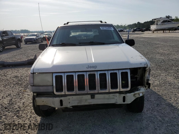 1996 Jeep Grand Cherokee Laredo z VIN 1J4EX58S3TC144191, wystawiony jako Copart lot #53153495 z przebiegiem 197 853 mil mil oraz Szkoda całkowita • Salvage title. Historia ofert i sprzedaży dostępna na DreamBid. Obrazek 5.