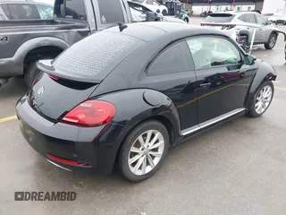 2017 Volkswagen Beetle 1.8T SE with VIN 3VWJ17AT9HM618202, listed as a IAAI auction lot 41562078 with 101,808 mi miles. Bid and sale history available at carsss.com. Image 4.