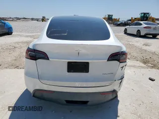 2023 Tesla Model Y Long Range z VIN 7SAYGDEE1PA155629, wystawiony jako Copart lot #52234735 z przebiegiem 24 944 mil mil oraz Szkoda całkowita • Salvage title. Historia ofert i sprzedaży dostępna na DreamBid. Obrazek 6.