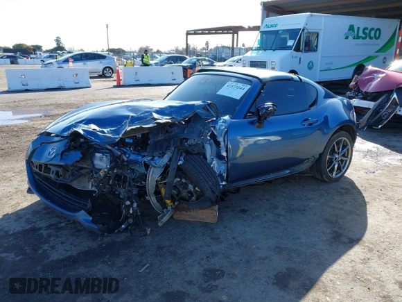 2020 Mazda MX-5 Miata Grand Touring z VIN JM1NDAM75L0412507, wystawiony jako IAAI lot #41573544 z przebiegiem Nie podano mil oraz . Historia ofert i sprzedaży dostępna na DreamBid. Obrazek 2.