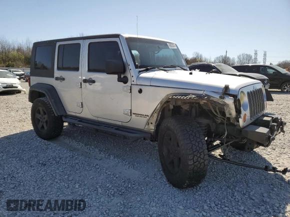 2010 Jeep Wrangler Unlimited Rubicon with VIN 1J4BA6H12AL107485, listed as a Copart auction lot 48802825 with 123,299 mi miles and Salvage title. Bid and sale history available at DreamBid. Image 4.