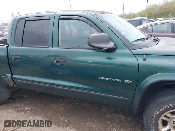 2001 Dodge Dakota Sport z VIN 1B7HG2ANX1S256902, wystawiony jako IAAI lot #42037703 z przebiegiem 121 914 mil mil oraz . Historia ofert i sprzedaży dostępna na DreamBid. Obrazek 13.