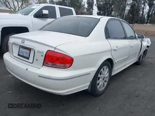 2004 Hyundai Sonata GLS with VIN KMHWF35H64A946091, listed as a IAAI auction lot 41871059 with 150,658 mi miles. Bid and sale history available at carsss.com. Image 4.