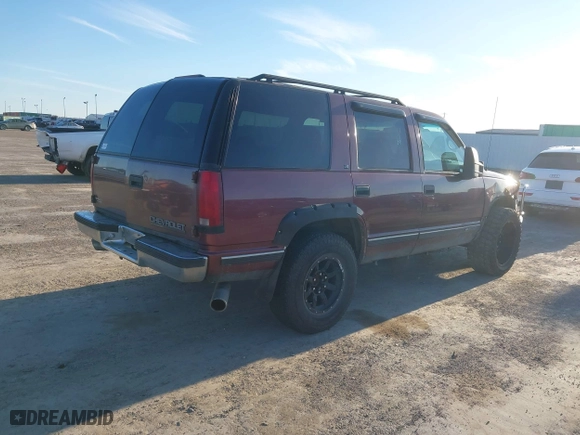 1996 Chevrolet Tahoe with VIN 1GNEK13R9TJ408499, listed as a IAAI auction lot 41308726 with 118,336 mi miles. Bid and sale history available at carsss.com. Image 4.