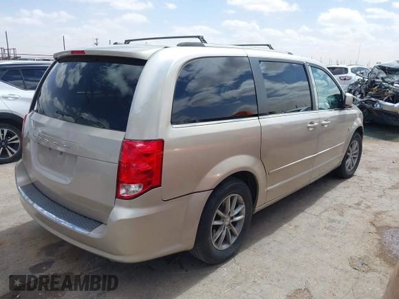 2014 Dodge Grand Caravan SXT with VIN 2C4RDGCG6ER466459, listed as a IAAI auction lot 41820907 with 105,404 mi miles and . Bid and sale history available at DreamBid. Image 4.