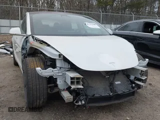 2020 Tesla Model 3 Standard Range Plus with VIN 5YJ3E1EA1LF799766, listed as a IAAI auction lot 41386508 with 90,000 mi miles. Bid and sale history available at carsss.com. Image 6.
