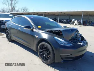 2020 Tesla Model 3 Standard Range Plus with VIN 5YJ3E1EA0LF597761, listed as a IAAI auction lot 41773918 with 89,957 mi miles. Bid and sale history available at carsss.com. Image 1.