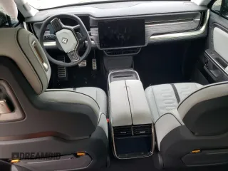 2024 Rivian R1T Adventure z VIN 7FCTGCAA1RN030829, wystawiony jako Copart lot #81459854 z przebiegiem Nie podano mil oraz Szkody całkowita. Historia ofert i sprzedaży dostępna na DreamBid. Obrazek 8.