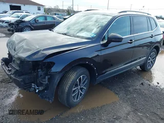 2020 Volkswagen Tiguan SE with VIN 3VV2B7AX5LM091857, listed as a IAAI auction lot 41922727 with 83,464 mi miles and . Bid and sale history available at DreamBid. Image 2.