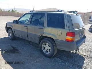 1997 Jeep Grand Cherokee Laredo with VIN 1J4GZ58S3VC603239, listed as a IAAI auction lot 42593915 with 295,696 mi miles and . Bid and sale history available at DreamBid. Image 3.