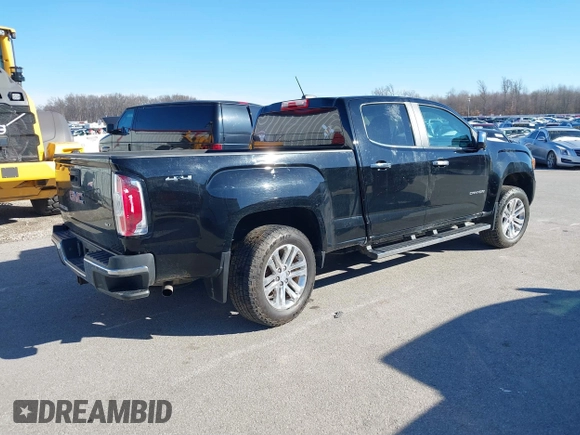 2015 GMC Canyon 4WD SLT z VIN 1GTG6CE33F1134747, wystawiony jako IAAI lot #41502300 z przebiegiem 143 027 mil mil oraz . Historia ofert i sprzedaży dostępna na DreamBid. Obrazek 4.