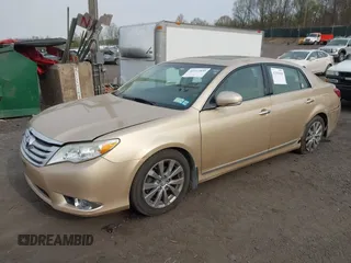 2011 Toyota Avalon with VIN 4T1BK3DB5BU414687, listed as a IAAI auction lot 42103830 with 130,045 mi miles and . Bid and sale history available at carsss.com. Image 2.